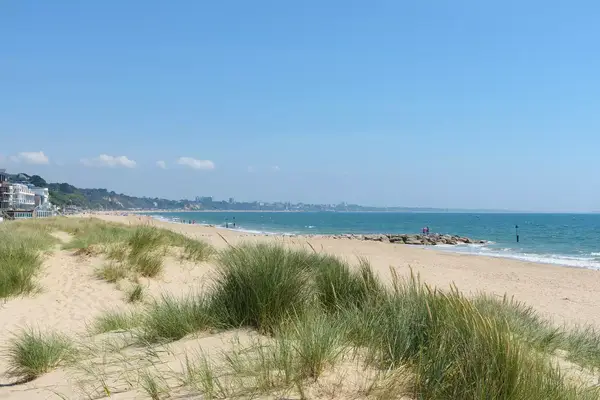 Sandbanks beach with the dunes and Bournemouth in the distance