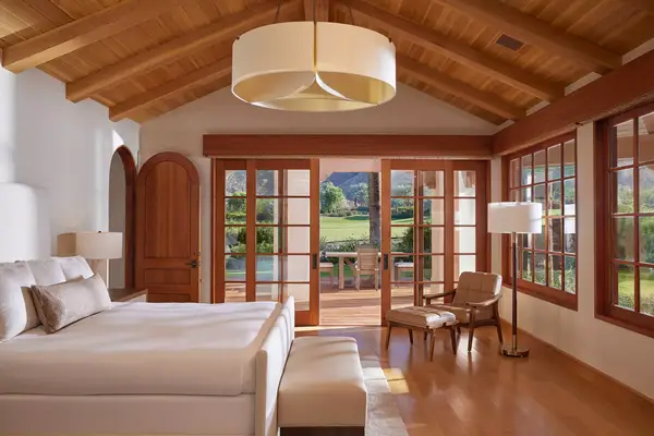 Bedroom interior at villa with golf course views at Sensei Porcupine Creek in California