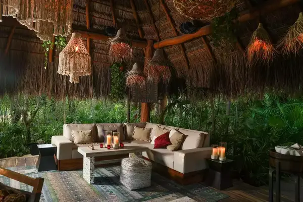 The couches inside La Isla Secreta, the secret bar at Rosewood Mayakoba