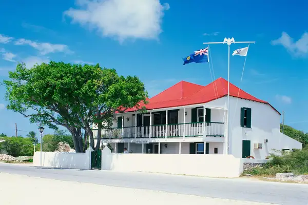 Building housing the Turks and Caicos National Museum with flags flying