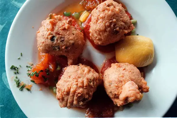 A plate of conch fritters