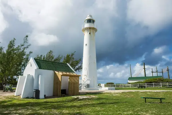 View of lighthouse against cloudy sky in Grand Turk