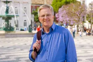 Rick Steves in Rossio Square in Lisbon, Portugal while filming Rick Steves