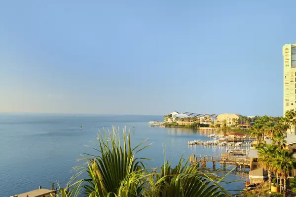 A view of Laguna Madre from South Padre Island, Texas. Beach condos and a high rise loom over the marina.