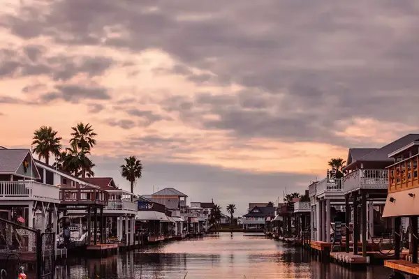 Jamaica Beach waterfront homes at sunset. Galveston, Texas, USA