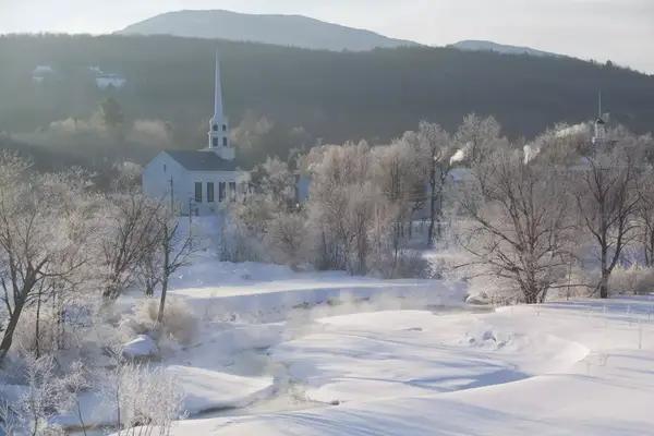 Sunrise over Stowe Community Church on a cold winter morning, Stowe, Vermont, USA