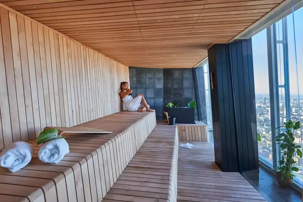 A woman sits in a sauna overlooking London from Shangri-La, The Shard