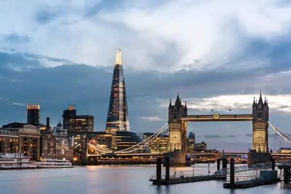 Exterior view of the Shangri-La, The Shard in London amongst the famous skyline and bridge during dusk