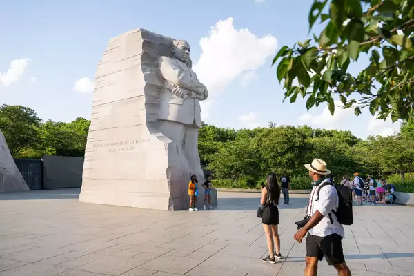 A family taking photos near the MLK memorial