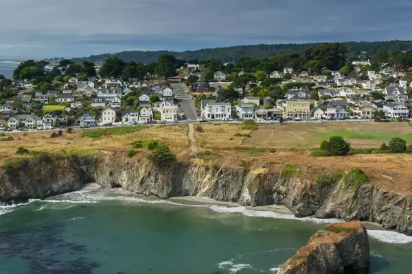 aerial view of mountain side coastal town