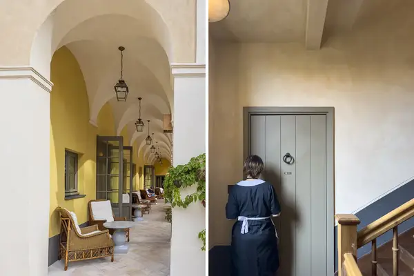 Outdoor veranda seating at a hotel with an archway a staff member in uniform stands next to a door