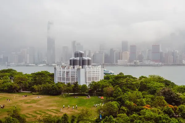 A foggy sky above a park.