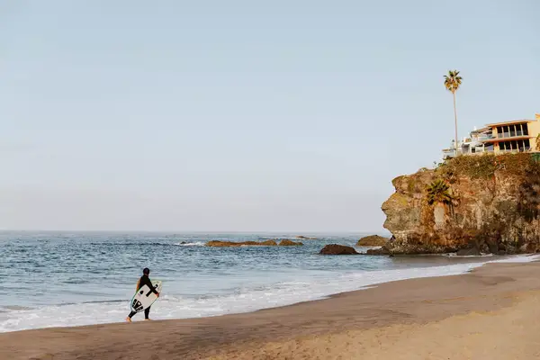 Surfer on Thousand Steps beach