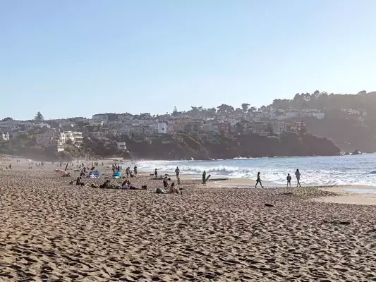 People on Baker beach on a sunny day