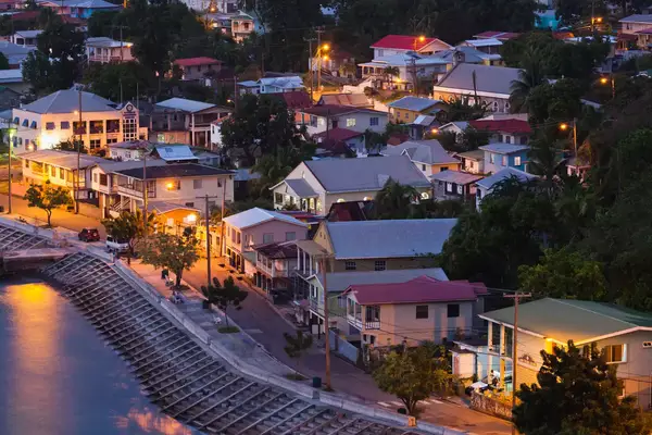 St. Vincent and the Grenadines, St. Vincent, Leeward Coast, Layou, elevated town view, dusk.