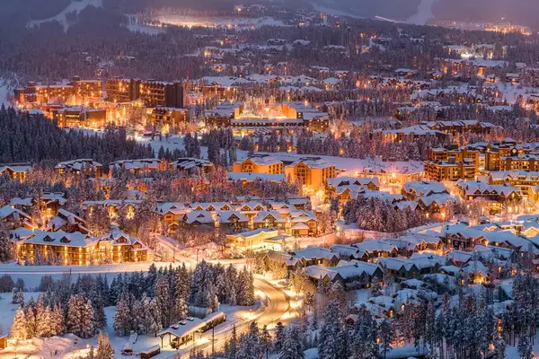 Breckenridge, Colorado town skyline in winter at dusk.