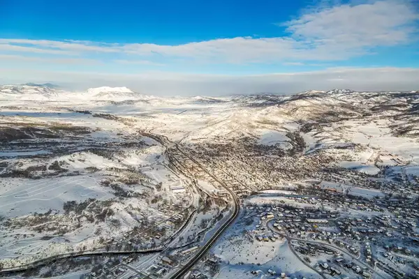 Steamboat springs, Colorado town from a hot-air balloon midair during a sunny winter day.