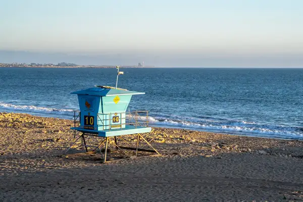 Lifeguard tower on a sandy beach near the ocean
