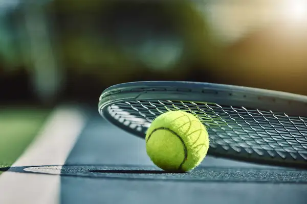Tennis ball, racket and court ground with mockup space, blurred background or outdoor sunshine