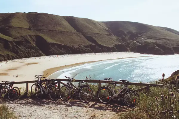 Bikes parking near the nudist beach of Torimbia in Llanes, Asturias, Spain