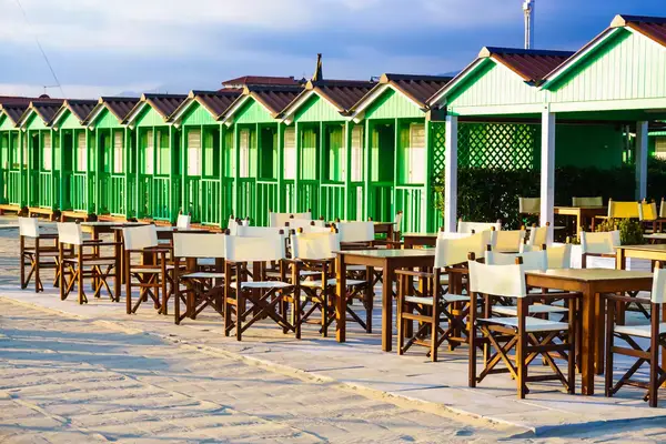 Forte dei Marmi, a beautiful beach with cabins at sunset, Versilia, Tuscany, Italy.