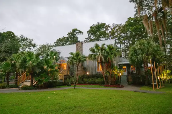 Exterior of a building surrounded by Palmetto trees
