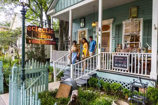 A group of people leaving a store.