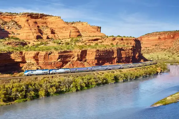 Train next to river 