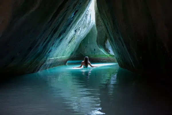 Bikini Woman standing in the cave at The Baths, Virgin Gorda