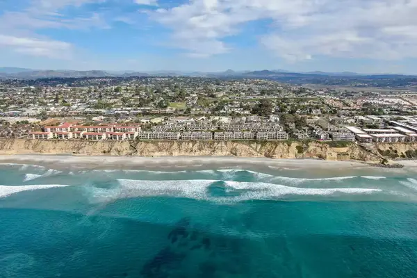 Aerial view of condo community next to the beach and sea in south california