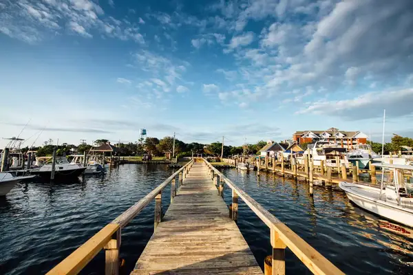 Wide angle of a long dock at a marina in Ocracoke, North Carolina