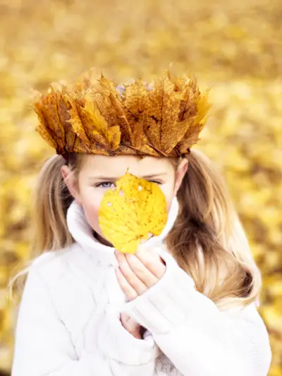 girl with a crown made of autumn leaves