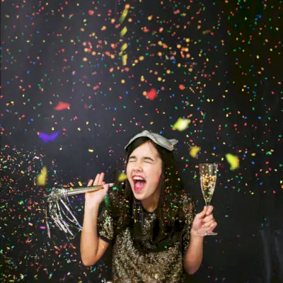 friends taking selfies with smart phone on new year eve