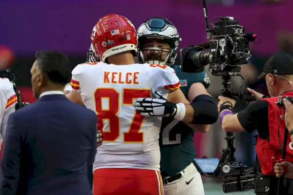 glendale, arizona february 12 travis kelce 87 of the kansas city chiefs hugs jason kelce 62 of the philadelphia eagles before super bowl lvii at state farm stadium on february 12, 2023 in glendale, arizona photo by ezra shawgetty images