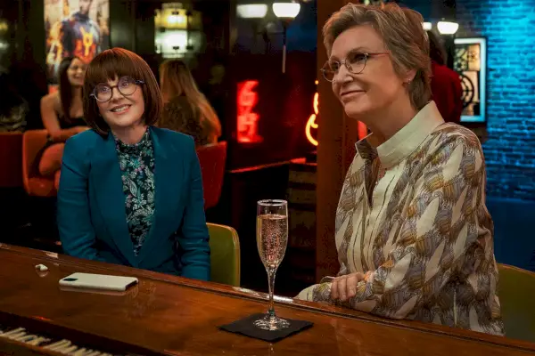 megan mullally as lydia and jane lynch as constance at the bar in a scene from party down scene 3