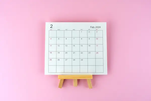 february 2024 desk calendar on wooden easel with the 29th day marking the leap year day