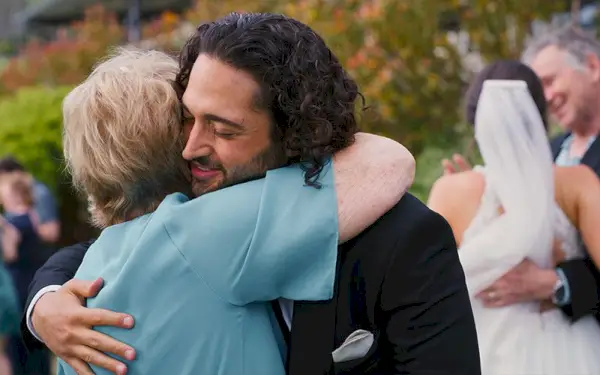 mother and son at a wedding dancing