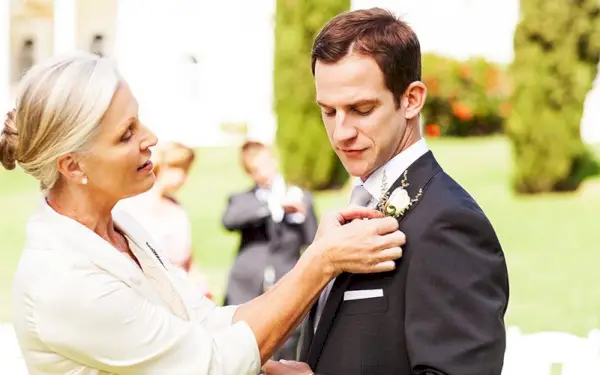 mother and son at a wedding with song