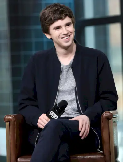 White-collar worker, Outerwear, Suit, Sitting, Blazer, Photography, Formal wear, 