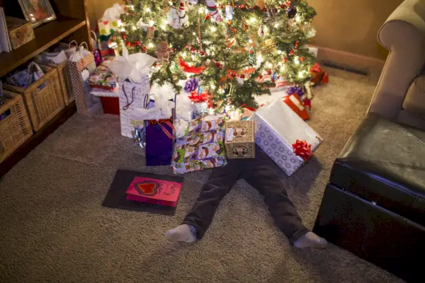 dad buried in christmas gifts