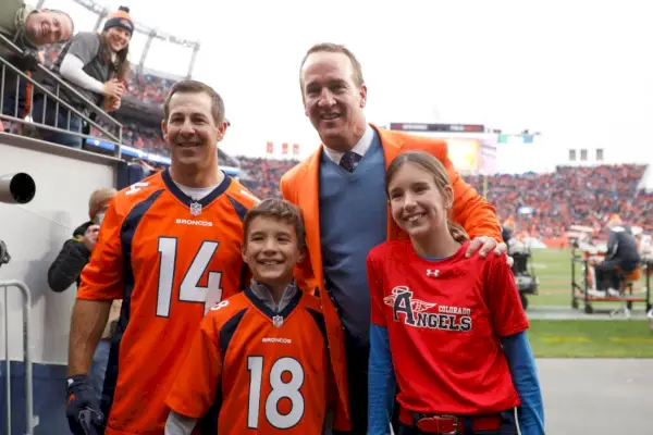 denver, colorado october 31 brandon stokely, peyton manning, marshall manning, and mosley manning pose for photos during a ring of honor induction ceremony at halftime of the game between the washington football team and denver broncos at empower field at mile high on october 31, 2021 in denver, colorado photo by justin edmondsgetty images