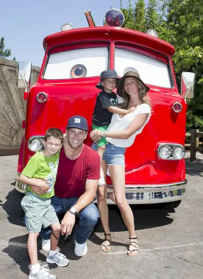 anaheim, ca july 02 in this handout photo provided by disney parks, tom brady, his son jack, 5, gisele bundchen, and their son benjamin, 3, pose with red the fire truck at cars land at disney california adventure park july 2, 2013 in anaheim, california the 12 acre cars land immerses guests in the thrilling world of the disney pixar blockbuster cars film franchise as they step into the town of radiator springs photo by paul hiffmeyerdisneyland resort via getty images