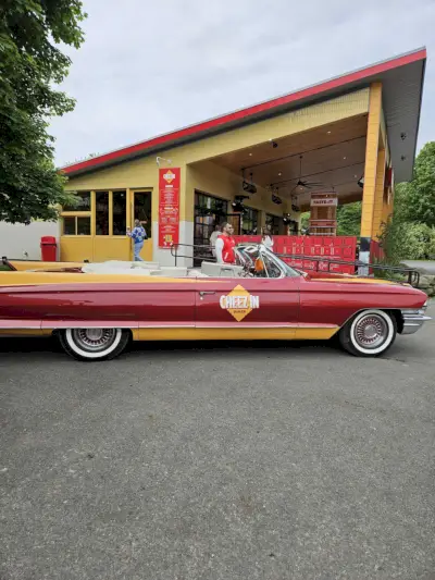 a red car parked outside a building