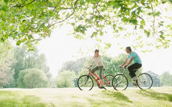 second date ideas with couple riding bikes at a park