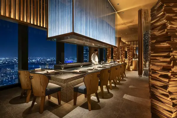A hotel restaurant with a view of Osaka.
