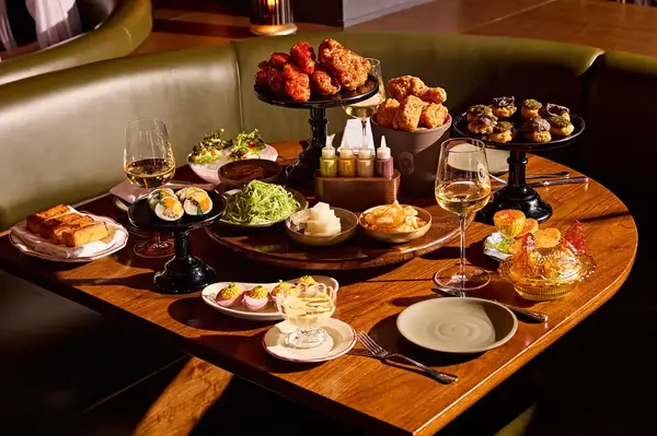 A table set with an assortment of dishes and drinks arranged elegantly in a dining setting