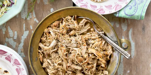 food leftovers packaged in boxes inside a home fridge