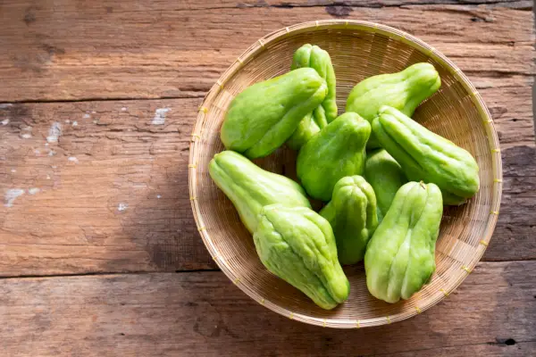 fresh chayote fruits sechium edulis on wood background