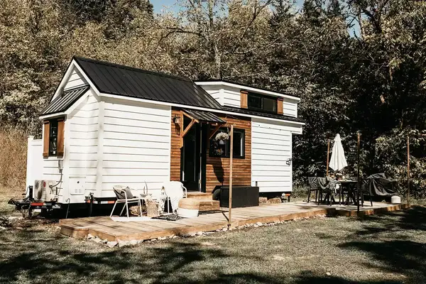 White and dark wood exterior of tiny home