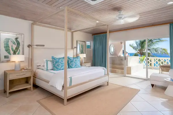 A guest room bedroom at Curtain Bluff hotel in Antigua 